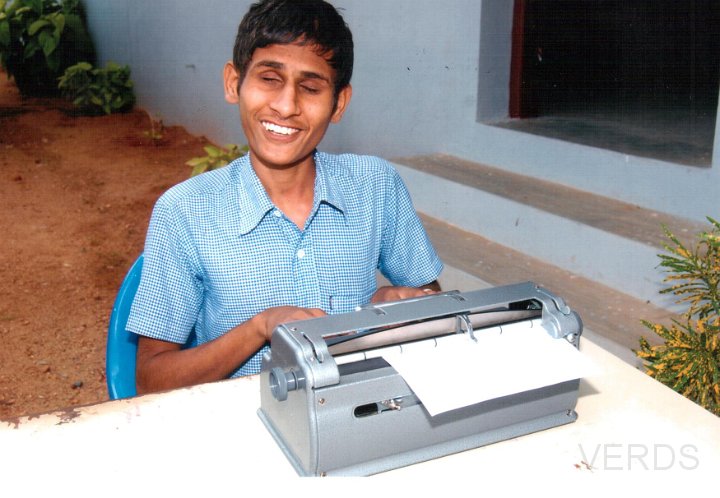 Differently abled student learning by Braille.jpg
